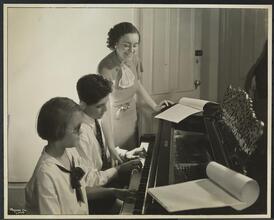 New York Association for the Blind, Group of Three, Blind Teacher and Boy and Girl Playing Piano.