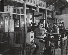 [Turnstile at the elevated railroad.]