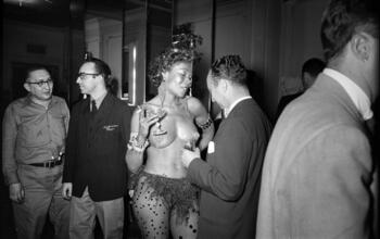Art Students League Ball [Man looking at a costumed woman.]