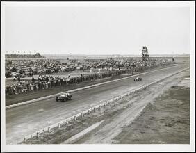 Westbury. Roosevelt Raceway. Vanderbilt Cup Race. View of track, racers and spectators