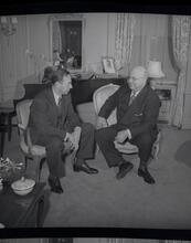 Henry Kaiser at office in Rockefeller Center with two sons