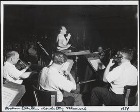 [Abe Ellstein conducting a rehearsal.]