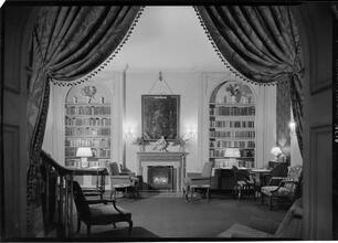 Embassy Club. Fireplace detail thru drape.