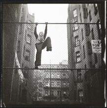 Shoe Shine Boy [Mickey climbing a fence.]