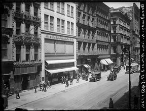 Broadway Series. View of the west side of Bway, looking north from Howard Street. The Globe-Wernicke Building is No. 451. Grand Street is seen in the middle distance at right.