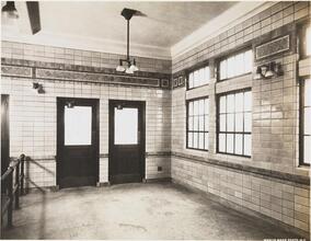 [Interior of an unidentified train station.]