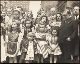 Hungarian celebration in front of City Hall, Mayor La Guardia with group of Hungarian-American children in costume