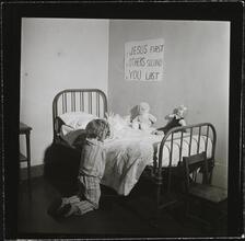 Orphanage [Girl praying.]