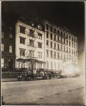 [Street scene at night.]