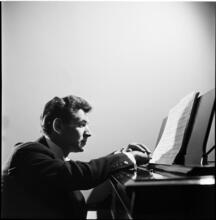 Leonard Bernstein [Leonard Bernstein at a piano.]
