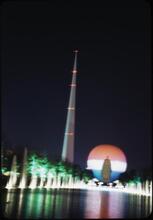 [The Trylon and Perisphere lit up at night.]