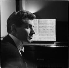 Leonard Bernstein [Leonard Bernstein at a piano.]