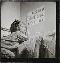Orphanage [Girl praying.]