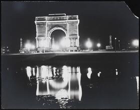 [Grand Army Plaza at night.]