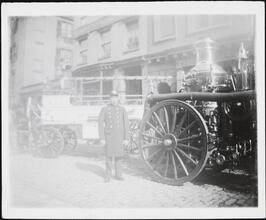 [Fireman with early fire engines.]