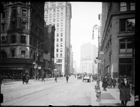 Broadway Series. Looking north showing the west side of Broadway from 20th Street. No. 903 is on corner at the left. Flatiron Building is seen in center of picture and a part of Madison Square.