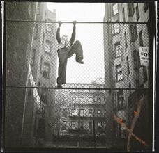 Shoe Shine Boy [Mickey climbing a fence.]