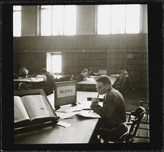 Columbia University [Student studying in Butler Library.]