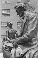 Harlem ["Abraham Lincoln with a child" bronze sculpture by Charles Keck in the Lincoln Houses complex.]