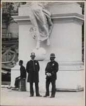 [Policemen in front of pylon of Dewey Arch]