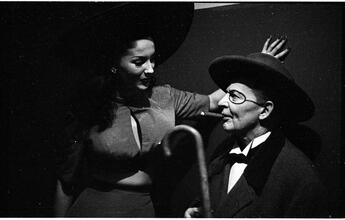 Show Girl [Rosemary talking to a man in costume.]