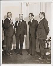 [Guy Van Amringe with three unidentified men.]
