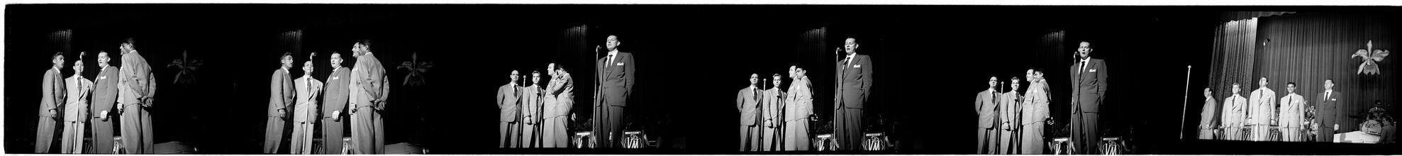 Vaughn Monroe [Monroe and a group of men singing on stage.]