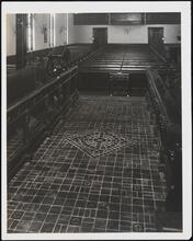 [Church. Interior, aisle towards rear.]