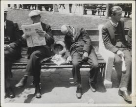 [Destitute man sleeping on park bench.]