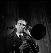 Swing Band Contest Sponsored by LOOK [Man playing the trombone.]