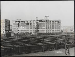 Long Island City. Factory building with rail yard in foreground