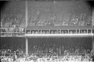 Football Writers [Fans in the stadium.]