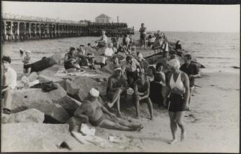 [People relaxing on Coney Island beach.]