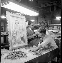 Art in the Marketplace [Painting in a seafood vendor's stand.]