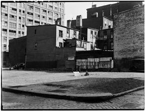 Empty Lot and Back of Wooden Houses
