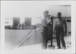 [Crew members on deck of ship.]