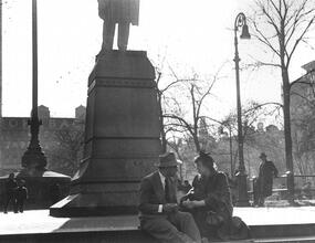 Untitled [Couple sitting at base of statue, Union Square]