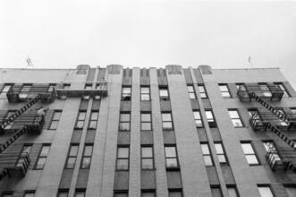 [Façade of an unidentified apartment complex.]