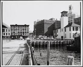 [Looking east toward the corner of Old Fulton and Water Streets from the edge of the East River.]