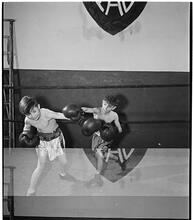 Boxing [at the] Police Athletic League [Two boys boxing.]