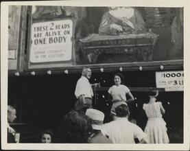 [Sideshow performers on Coney Island midway.]