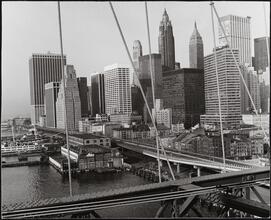 [Looking south from the Brooklyn Bridge walkway to Lower Manhattan.]