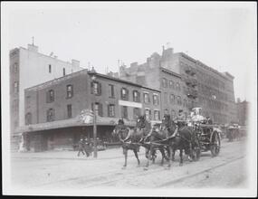 [Horse-drawn fire engine.]