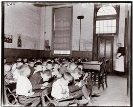 East Side Public Schools 2. Class without desks in the Essex Market School.
