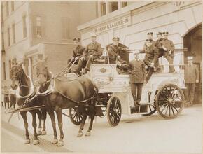 [Horse-drawn fire engine.]