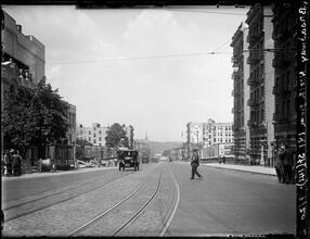 Broadway Series. View looking north from 181st Street. Church steeple in far distance. Blue Valley Butter on side of building at right in middle distance.