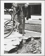 East 58th Street. Street opening, pneumatic drill tearing up pavement