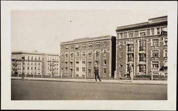 [Couple in front of apartments near Riverside Drive.]