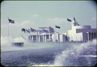[British and Italian Pavilions through the Lagoon of Nations.]