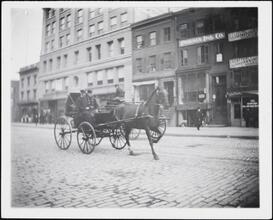 [Firemen in carriage.]